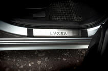Mitsubishi Lancer X 2008– Instaplijsten (OMSA, 4 stuks, RVS) foto 1