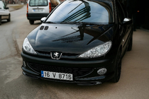 Peugeot 206 1998–2024 Voorbumper onderlip (spuitklaar) foto 1