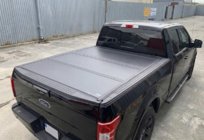 Toyota Hilux 2015– 4-delige opvouwbare laadbakafdekking foto 1