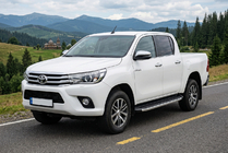 Toyota Hilux 2015– Fullmond side steps (2 stuks, aluminium) foto 1